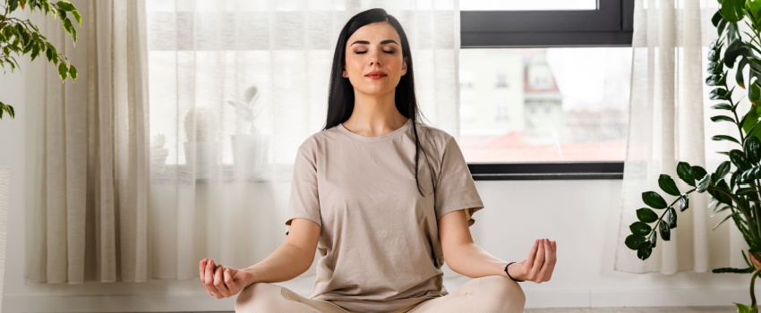 A woman meditating.